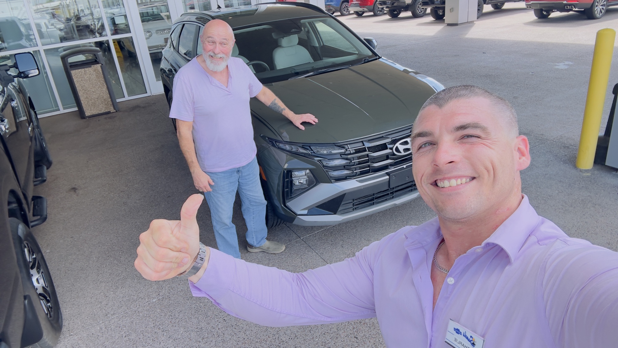 Charlie with a happy client at delivery