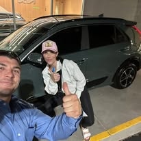 Satisfied buyer with their new vehicle