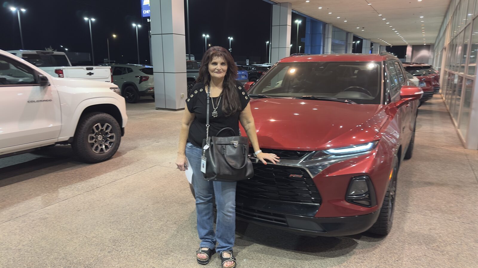 New owner with her red Blazer RS at night