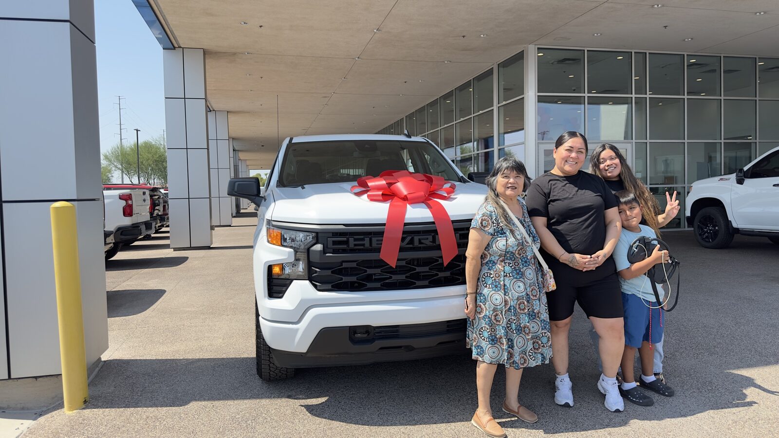 Family with their new Silverado on delivery day